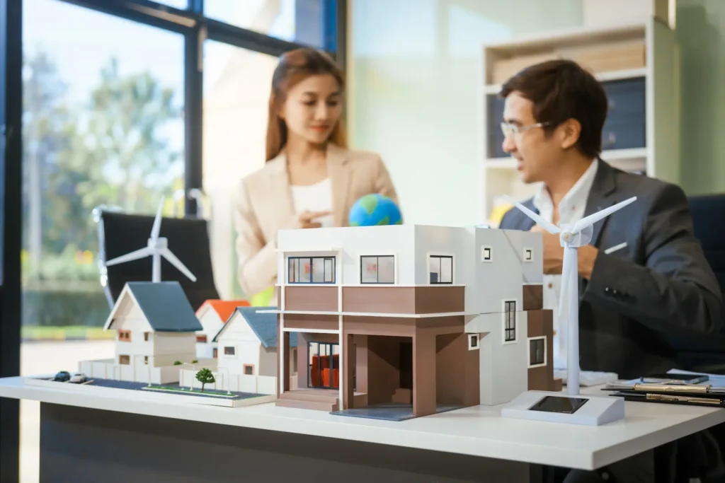 a businessman and woman sit at an office table dis 2025 02 15 20 24 57 utc